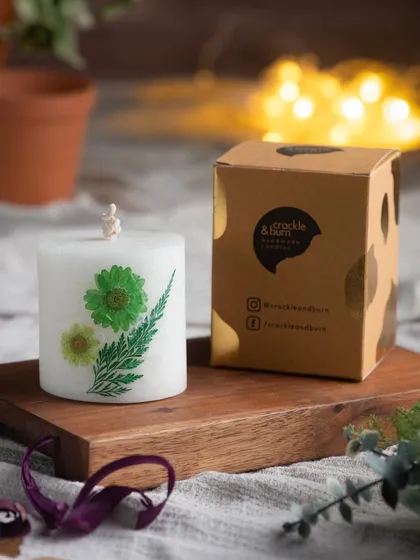 Another one of my pressed flower candles, this one featuring a fern leaf and green flowers. Each one is a unique piece of art.