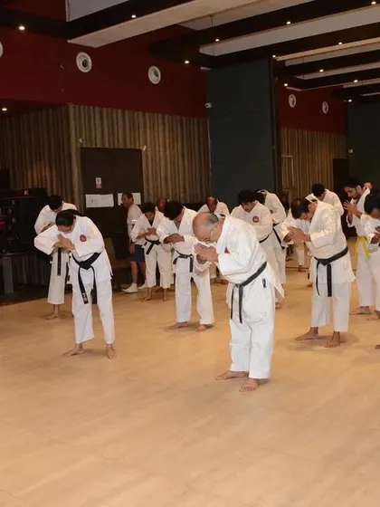 A group of our instructors and students bowing during the inauguration of our new dojo at P.J. Hindu Gymkhana. This event was graced by esteemed guests who share our passion for fitness and discipline.