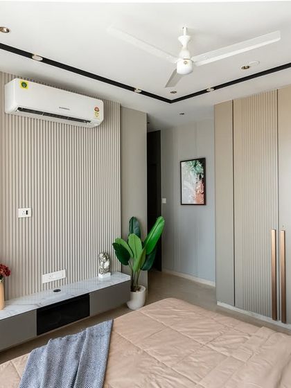 A bedroom that redefines quiet luxury. Vertical louvers create a textured rhythm, the curved open shelving cabinet softens the space, and the high-gloss PU finish wardrobe reflects contemporary style.