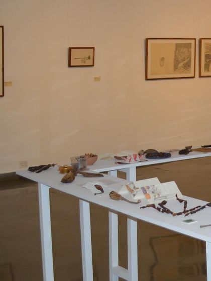 An installation view from 'Bring me Flowers', showing the display of found objects and drawings. The curation focused on creating a quiet, contemplative space for viewers to engage with the artist's subtle storytelling.