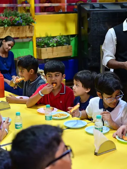 A table of happy kids enjoying their party meal together. I handle all the food so parents can relax and enjoy the day.