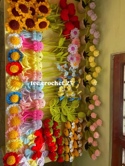 An overhead view of the colorful collection, showing the variety of amigurumi and flowers I offer.