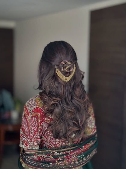 A slightly different angle of the rose bun half-updo, showing its intricate detail.