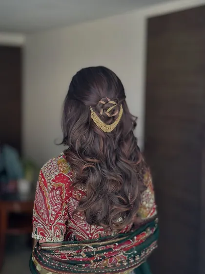 A side view of the rose-braid half-updo, showing the intricate detail of the hairstyle.