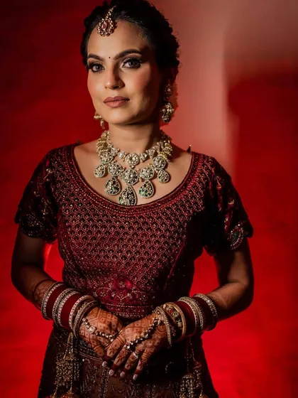 Shubhangi's wedding photos. I created a soft, romantic look with a messy braided bun and flawless makeup that lasted all night.