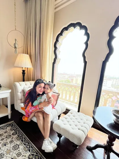 A precious moment with my daughter during our stay at Fairmont Jaipur. My off-shoulder floral dress from Myntra was a perfect choice for a luxurious weekend getaway.