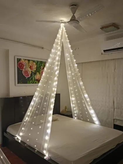 A simple yet beautiful bedroom transformation. I used a canopy of sheer fabric with fairy lights to create a dreamy and romantic space for a special occasion at home.