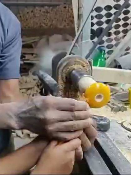 A child gets a hands on lesson in woodworking at a local toy factory. We partner with local artisans to provide unique, educational experiences.