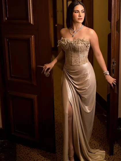 Amyra Dastur in a beautiful gown, framed by a doorway. This portrait plays with classic elegance, using the setting to create a sense of drama and romance.