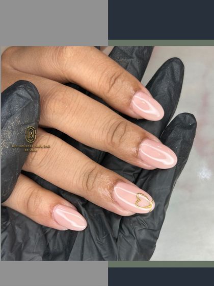 A simple yet stunning design featuring a delicate isolated chrome heart. This shows how a small, well-placed detail can make a big impact on a neutral base.