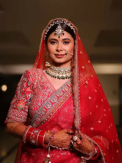 When tradition meets technique. A stunning red bride transformation, showcasing a classic look that is both timeless and elegant.