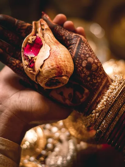 Another perspective of the Kanyadaan ritual, showing the joined hands and the bride's intricate mehndi. These are the details that tell a rich cultural story.