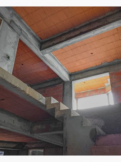The interplay of the concrete staircase and the filler slab ceiling at '15B HSR'.