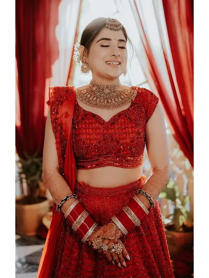 The pure joy of a bride on her wedding day. This portrait of Jhanvi captures a moment of genuine happiness, her eyes closed in a blissful smile.