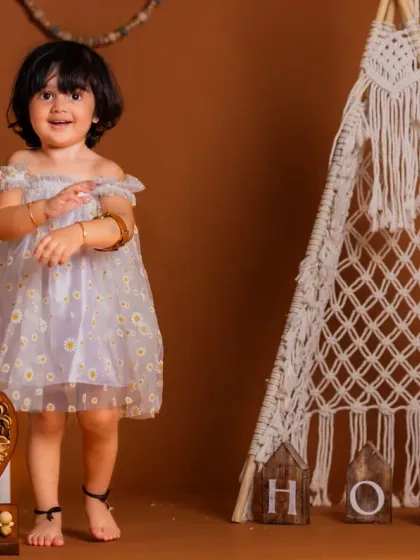 A happy two-year-old in our boho-themed teepee setup. This versatile set works beautifully for birthdays of all ages.