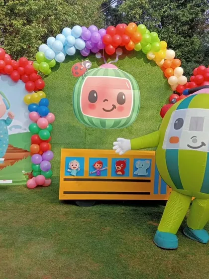 A look at a Cocomelon themed party I organized, featuring a friendly mascot and a colorful backdrop. I can coordinate the entertainment and decorations to create a cohesive and immersive party theme for your little ones.