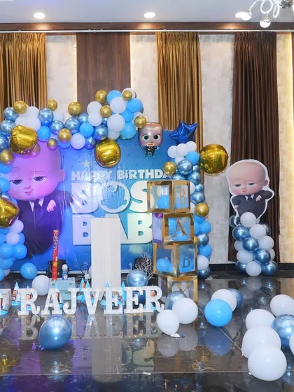 Another look at the impressive Boss Baby stage setup, showcasing the attention to detail with character standees and themed balloon colors.