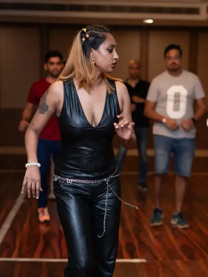 A candid shot from a workshop, where I'm demonstrating a move. I love interacting with my students and providing individual feedback.
