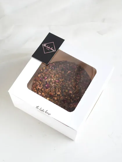 My Baklava Tea Cake packaged in a clean, white window box, making it a simple and elegant Rakhi gift.