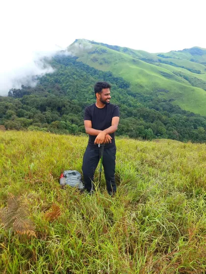 Taking a moment to soak it all in on the Netravati trek. The green hills and misty mountains are the perfect backdrop for a weekend escape.