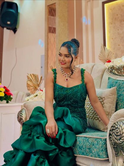 A smiling shot in my green reception gown. I always feel confident and ready to take the stage when my outfit perfectly matches the grandeur of the event.