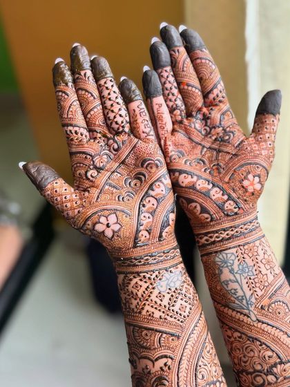 A close-up of the palms, where you can see the names "Kajol" and "PulsetoPromises" beautifully integrated.