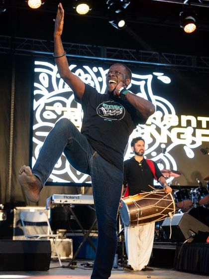 The high-energy Bhangra dancer Kala Sher, a frequent performer at my events, electrifying the crowd. I always include authentic dancers to teach moves and bring the true spirit of Bhangra to the party.