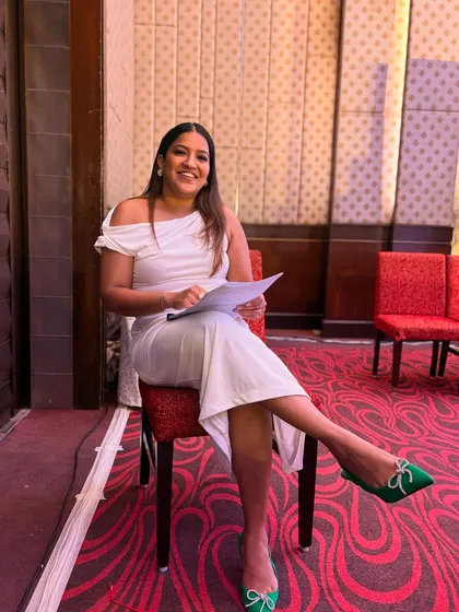 Backstage at the Pharma & Med Devices Conclave, reviewing my notes. Preparation is crucial for a flawless execution.