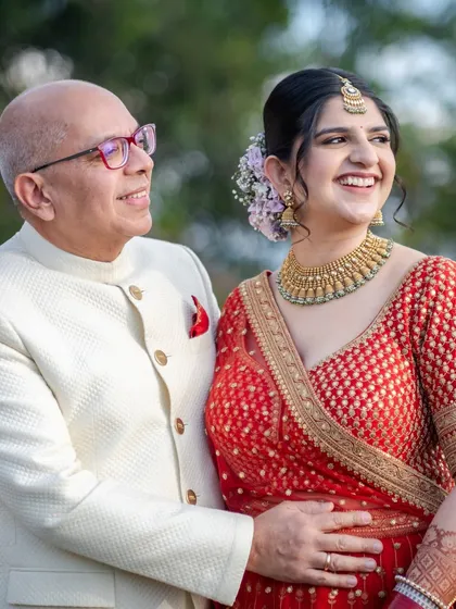 A proud father's embrace. This candid shot captures the beautiful bond between a father and his daughter on her wedding day.
