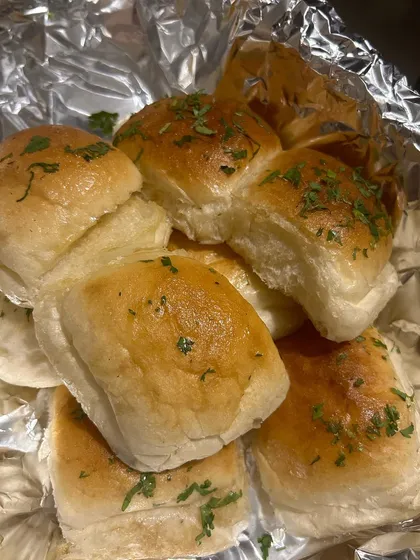 Soft, buttered pav, ready to be served alongside pav bhaji or other gravies.