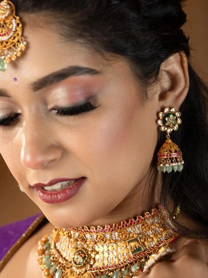 A detailed close-up of a festive bridal look. Notice the precise winged liner and the soft cut-crease eyeshadow, advanced techniques that are covered in my pro MUA classes.