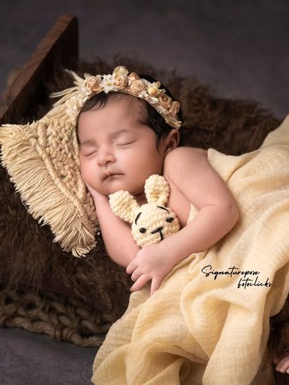 A duplicate of image 169, a peaceful newborn portrait with a rustic touch.