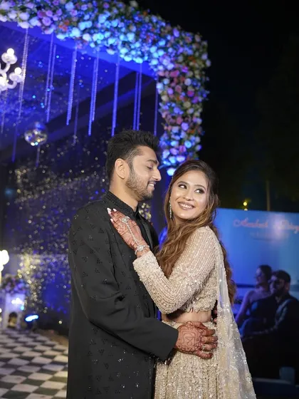The couple sharing a dance, the bride's makeup looking flawless and her smile radiant.