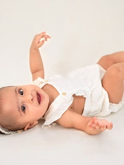 A sweet, simple portrait of a baby enjoying some tummy time. I capture all the little milestones, including their growing strength and curiosity.