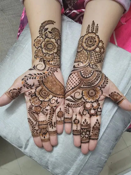 A compilation of party henna designs. This set shows an asymmetrical design with beautiful floral and paisley flows, perfect for a guest at any event.