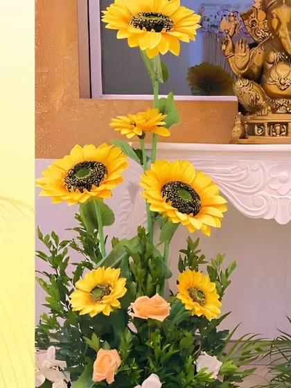 For Ganesh Chaturthi, we believe in creating a serene sanctuary. Here, a beautiful Ganpati idol is complemented by an elegant arrangement of bright sunflowers, symbolizing joy and divine energy, creating a peaceful and auspicious setting for prayers.