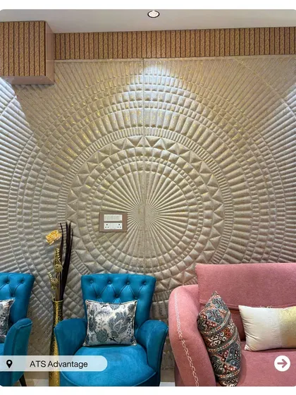 A close-up of the intricate 3D wall panel that serves as a stunning art piece in this living room. This detail adds texture and a unique focal point to the space.