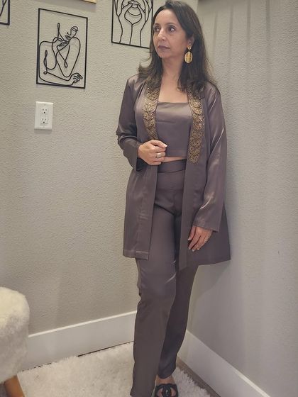 Here I am modeling the three-piece fusion jacket set. You can see how the pieces work together to create a sleek, monochromatic look that is both elegant and powerful. I love helping clients build these kinds of versatile, statement outfits.