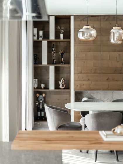 This living and dining area from the Silhouette project has an eclectic charm and sophisticated air. The open-plan layout, modern decor, and functional design make it the perfect backdrop for laughter, conversation, and making memories.