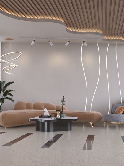 This lounge area uses a mix of curved and straight lines to create visual interest. The combination of a plush sofa, a structured armchair, and minimalist lighting results in a balanced and contemporary commercial space.