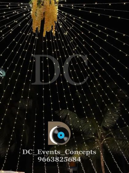 A close-up of a fairy light canopy, showing the dense web of lights that creates a magical, starry night effect for any evening event.