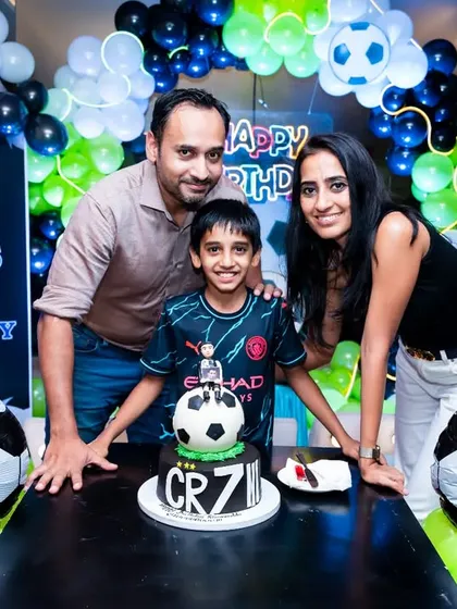 I love capturing the energy of kids' birthday parties. For this 9th birthday, we went all-in on a football theme, complete with a custom cake and decorations, creating a fun and memorable shot for the whole family.