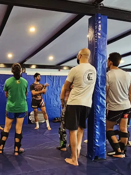 Students listening intently during our Muay Thai seminar. We create an environment where you can absorb high level details on theory and application from masters of the art.