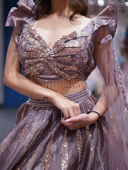 Delicate and feminine. This lilac lehenga with intricate embellishments is a perfect blend of softness and sparkle.