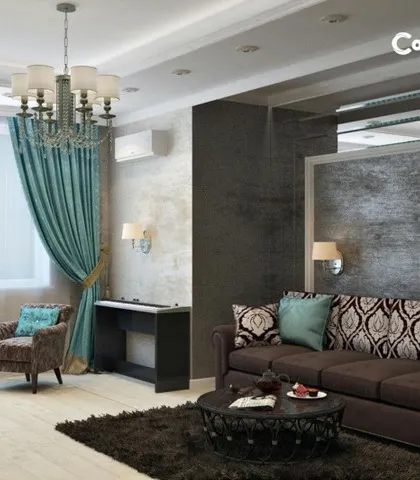 This image from our portfolio showcases a complete living room design. The tray false ceiling with an elegant chandelier is complemented by a textured accent wall and carefully selected paint colors, all services we provide.