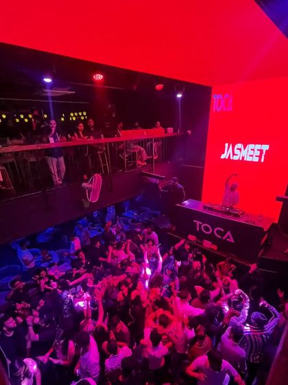 Another angle of the packed house at Toca, with my name lit up on the big screen.