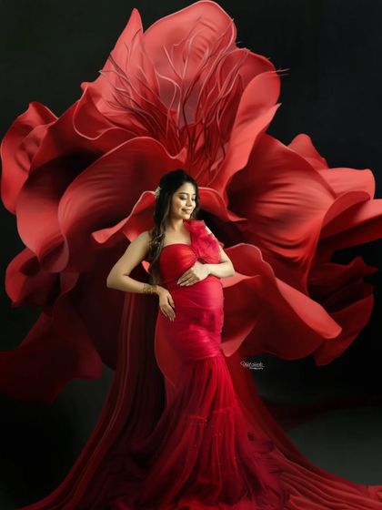 A stunning solo portrait in a dramatic red gown. The way the fabric flows around you creates a breathtaking image that is both powerful and beautiful.