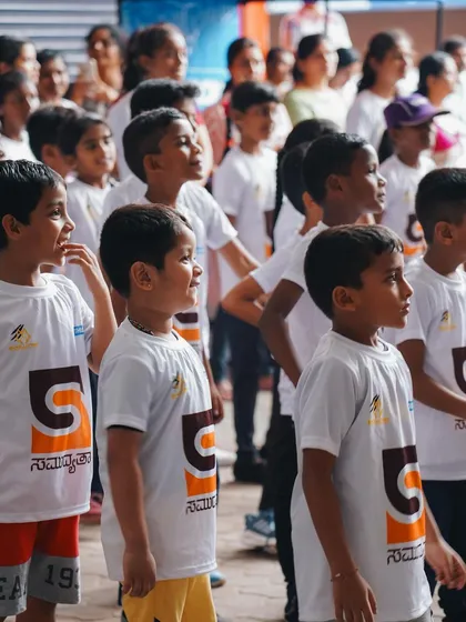 A crowd of enthusiastic kids ready to start the walkathon. Their energy was contagious.