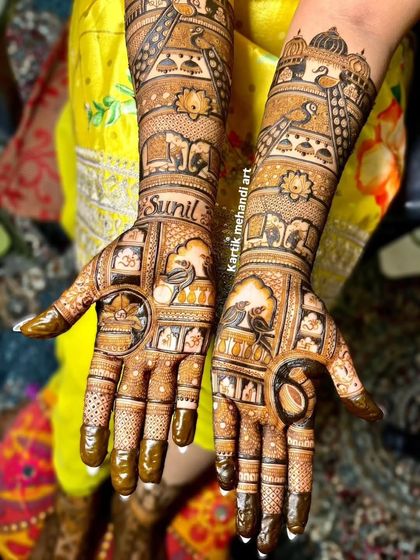 We can incorporate anything into your mehandi, including the groom's name. This intricate design features the name 'Sunil' alongside traditional motifs like birds, elephants, and architectural jharokhas.