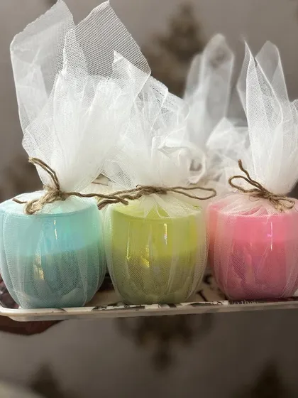 Our holographic candles look so lovely in simple net packaging. They are available in 6 colors and are perfect for any gifting occasion.
